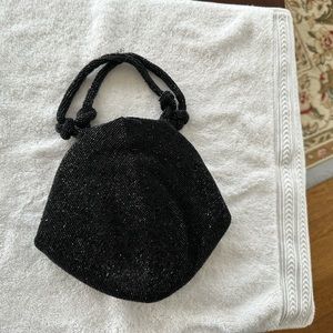 Antique sequence clutch bag in black. Size 8 inches long, 7 1/2 inches tall